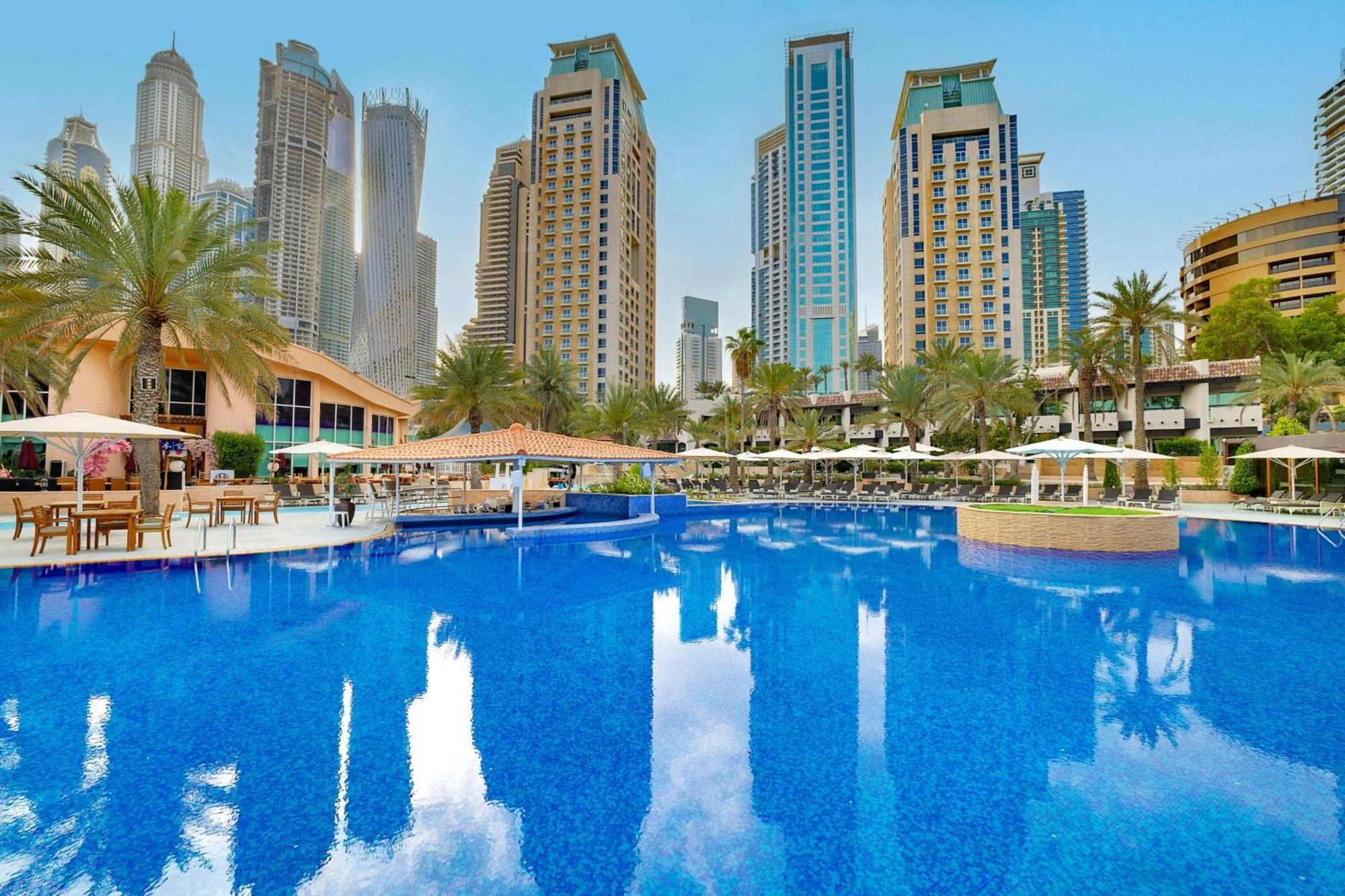 แฮบทัวร์ แกรนด์ รีสอร์ต ออโตกราฟ คอลเลคชั่น Hotel ดูไบ ภายนอก รูปภาพ The swimming pool at Jumeirah Beach Hotel