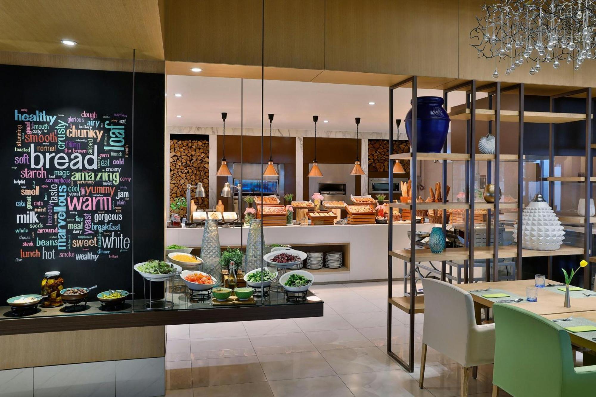 แฮบทัวร์ แกรนด์ รีสอร์ต ออโตกราฟ คอลเลคชั่น Hotel ดูไบ ภายนอก รูปภาพ The restaurant
